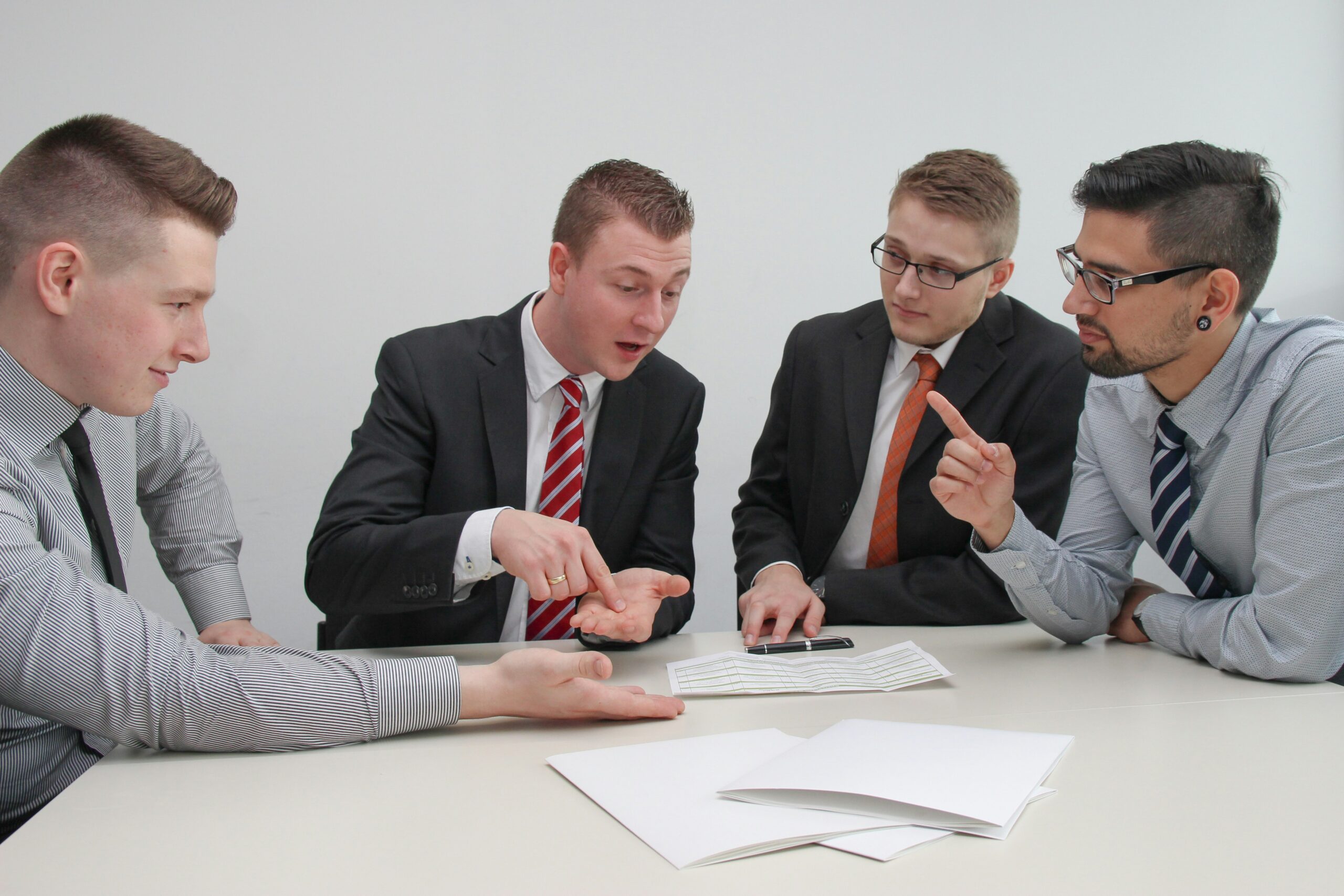 Sales team members discussing with each other